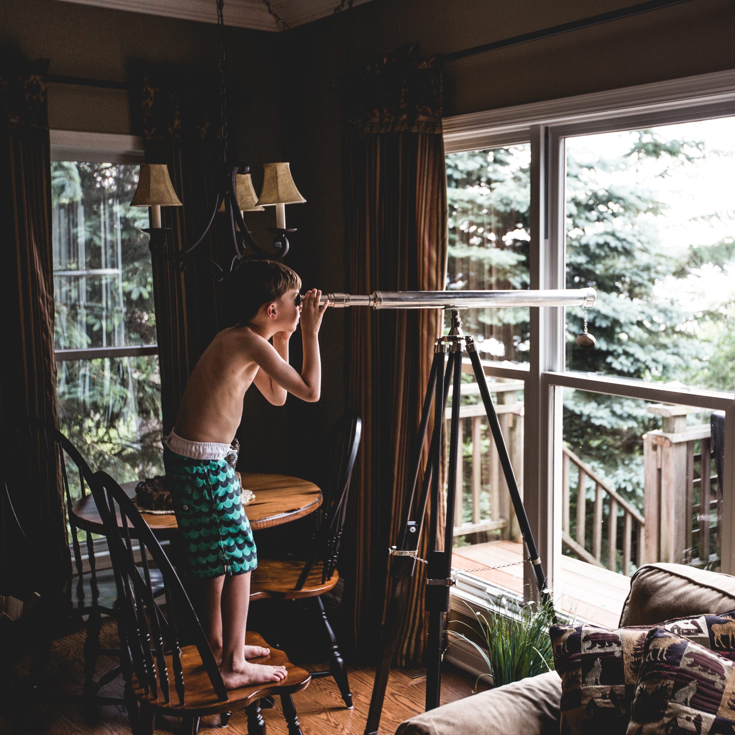 Child Looking Through Telescope